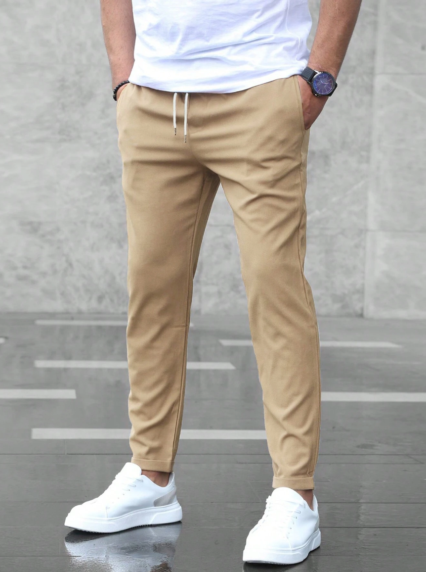 Leon - Spodnie męskie slim fit z elastycznym pasem i wiązaniem