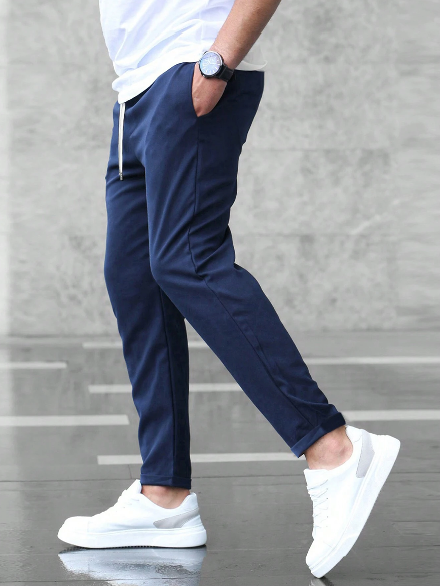 Leon - Spodnie męskie slim fit z elastycznym pasem i wiązaniem